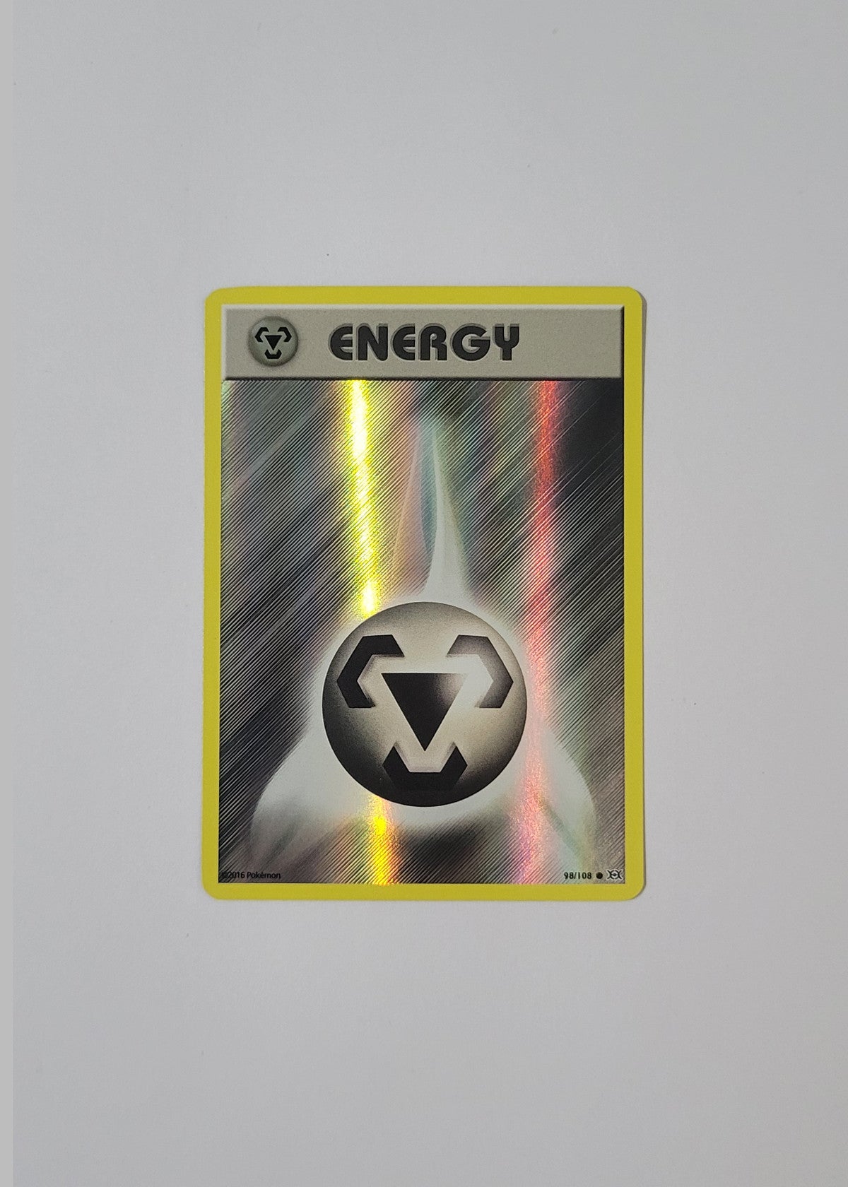 Metal Energy 98/108 (Holo) - Evolutions