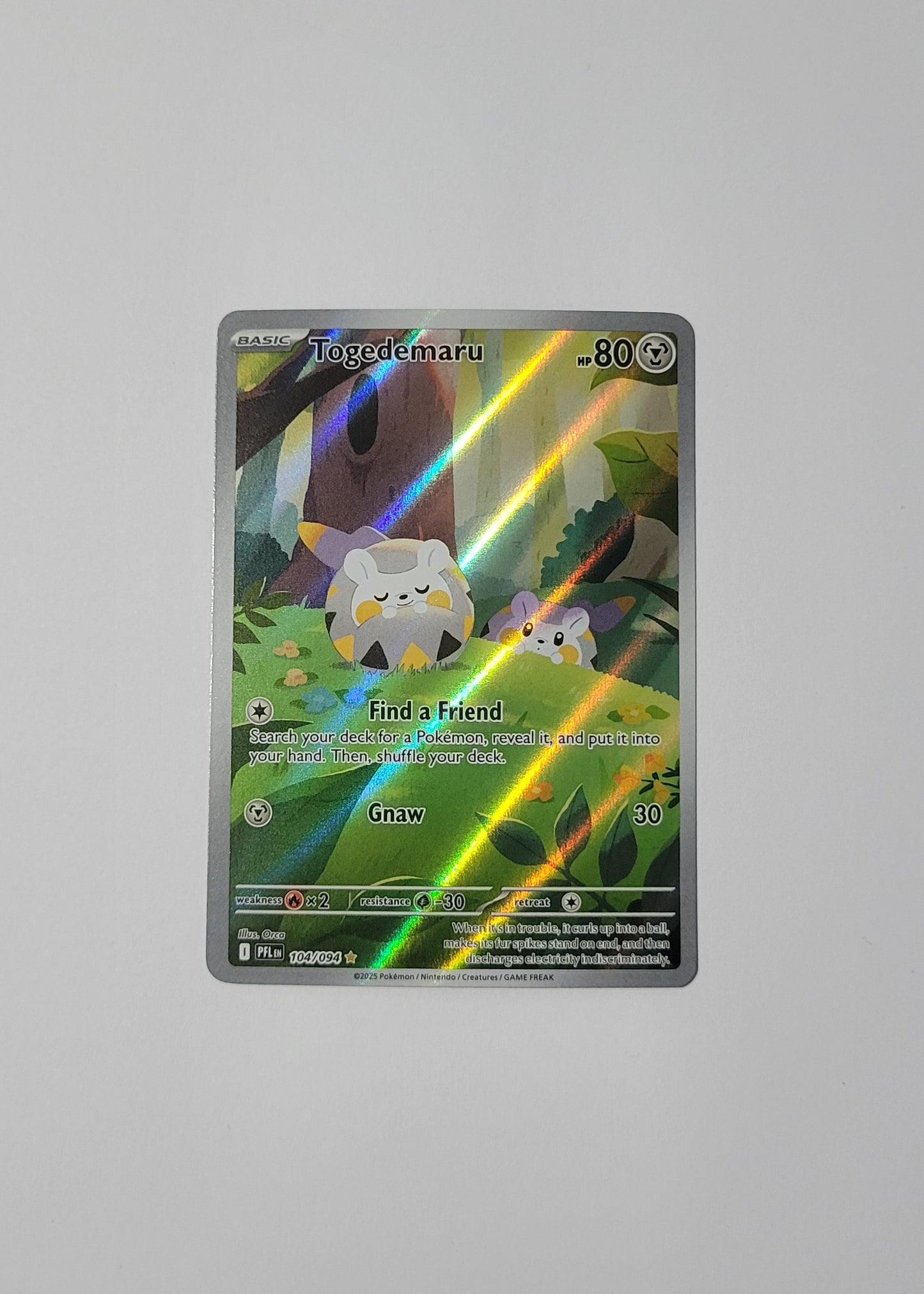 Togedemaru 104/094 - Phantasmal Flames